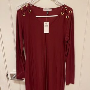 New with price tag. Dress long sleeve red. Fitted style.